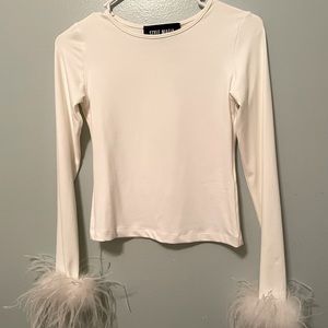 White top with very pretty feather on sleeves
